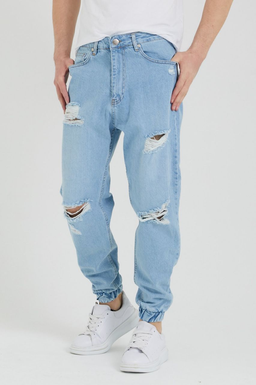 JEANS STRAPPATI COLORE BLU GHIACCIO CON ELASTICO ALLA CAVIGLIA