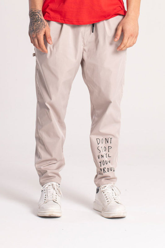 PANTALONI CON DETTAGLIO CATENA "DONT STOP UNTIL YOU ARE PROUD"